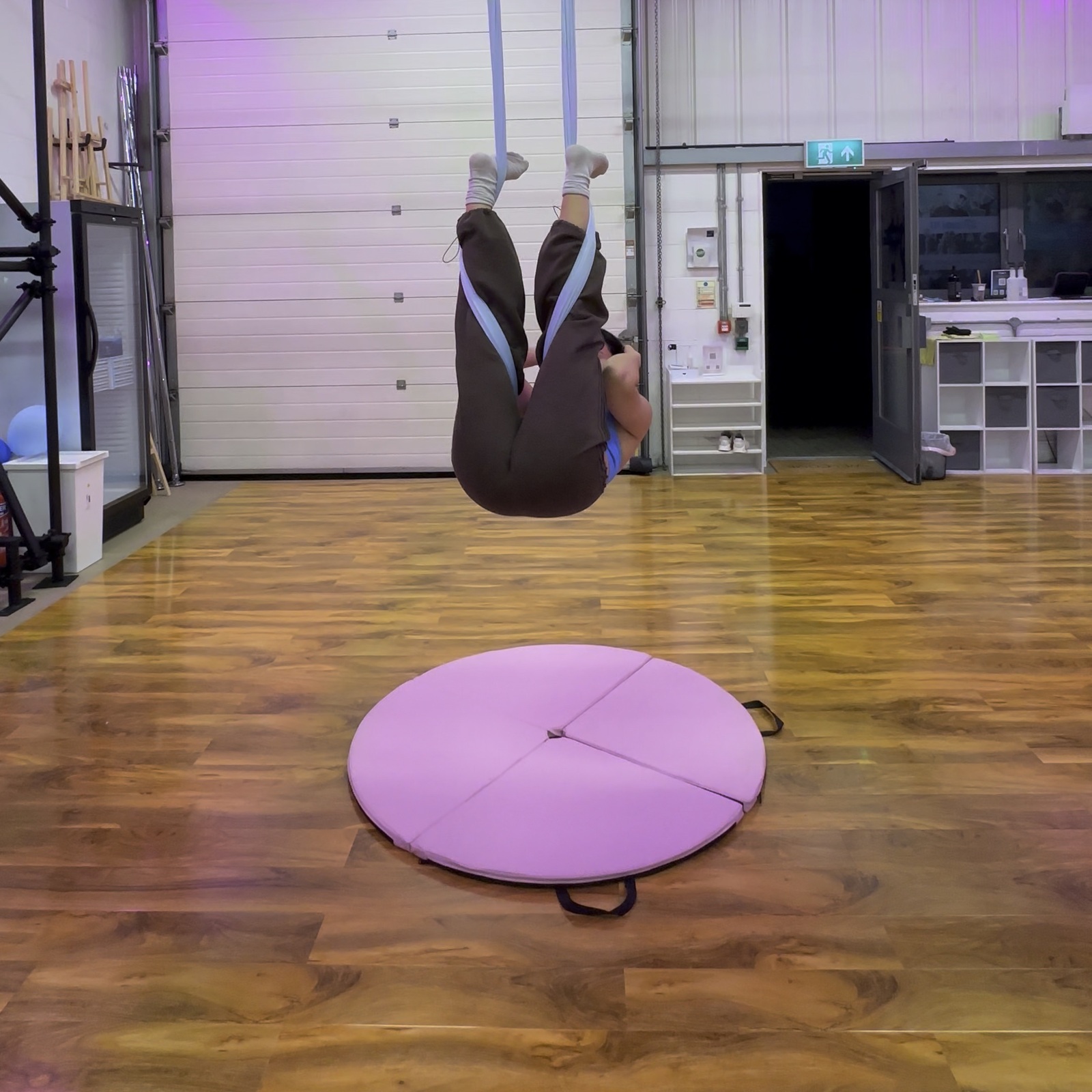 An optional upside-down core exercise supported by the hammock